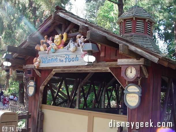 Real clocks are more signs at Pooh's entrance.