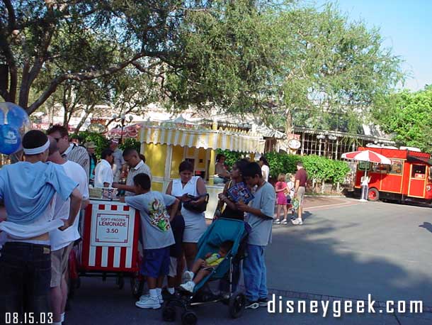 Makes sense, the new stand in the background open and you bring a cart selling basically the same product right in front of it...