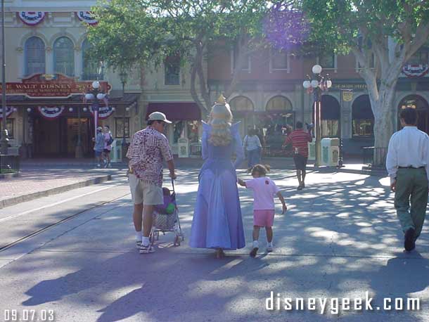 Sleeping Beauty walking with a child and without a crowd, a great thing to see.