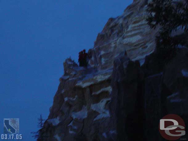 There was a group of CMs about half way up the mountain.  Not sure what they were up to.  At first I thought they were with the climber but they seemed to ignore him from what I could see and they were pointing and looking at Fantasyland.