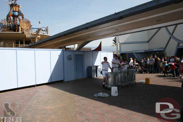 Walls have gone up in Tomorrowland (here the Trashcan Trio is performing near the Buzz store)