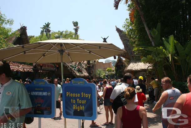 Heading to Adventureland there are signs, ropes, and Cast Members to keep the traffic moving