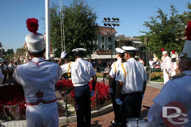 The Star Spangled Banner is played and the flags lowered