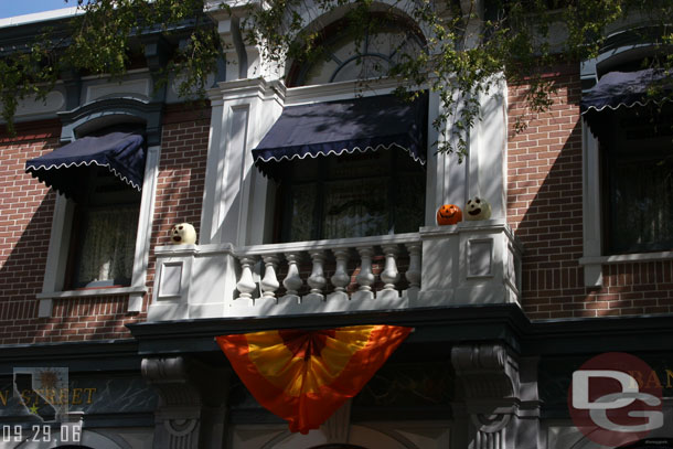 Main Street has pumpkins on balconies and in windows