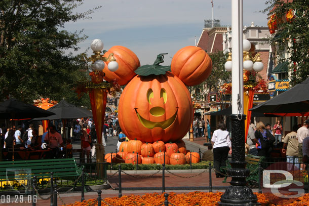 A giant Mickey pumpkin sits where the Christmas tree traditionally does