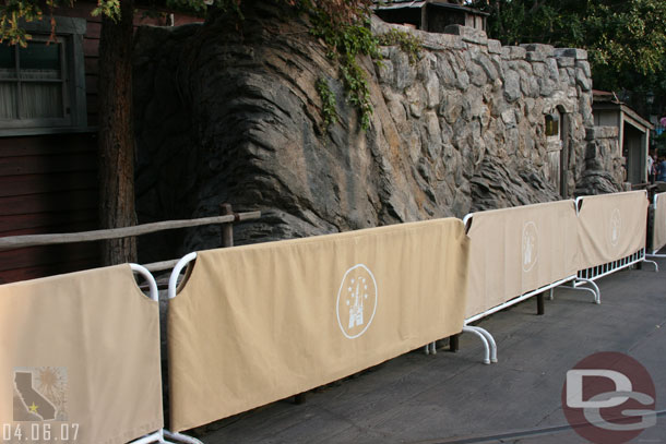 Painting the railings near the bridge in front of Splash Mountain