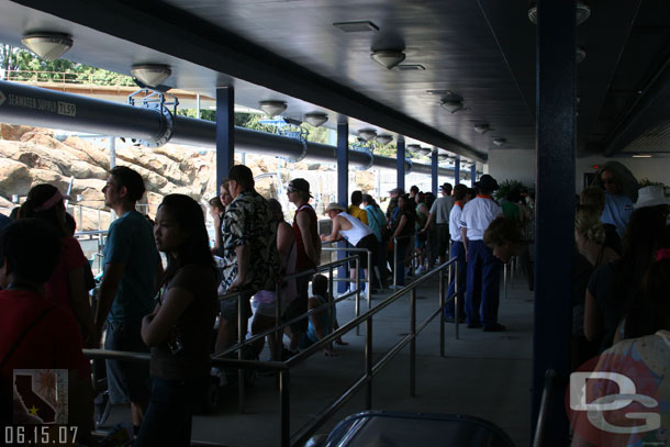 The is really no queue under the monorail station anymore, its a giant loading area for the most part.  They count off and have you go to a waiting area to go right on then.