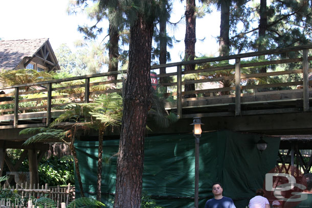 A tarp is set up on a portion of the train tressle in Critter Country again