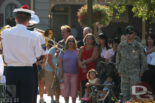 The flag retreat with a US Army soldier looking on, I noticed he has a purple heart medal on the right, I could not make out the one on the left.