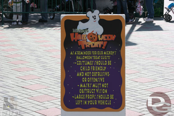 Signs up warning people that they cannot wear costumes in the parks except for the after hours party