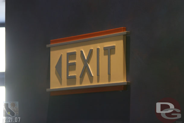 The exit signs have both now been fixed with raised letters again.