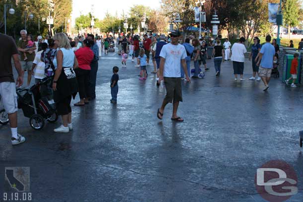 The ground after the Pixar Play Parade rolls by and soaks the audience.