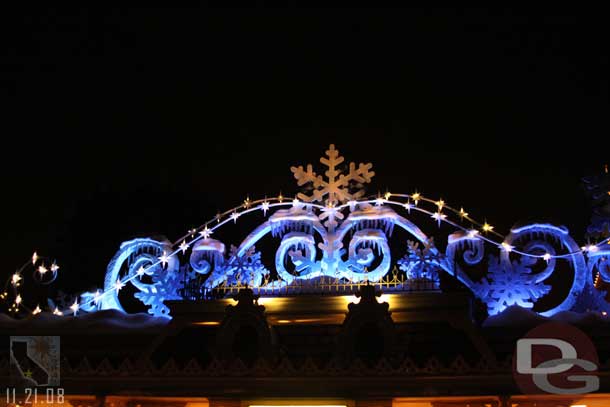 The Disneyland entrance decorations at night.