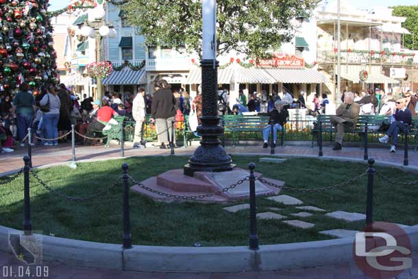 No flowers, just grass around the flag pole today.