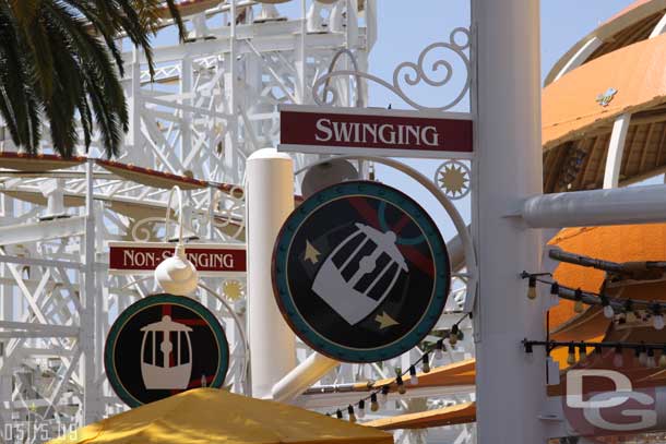 The entrance is now in the center of the wheel for both swinging and non swinging then you walk through a chain queue to enter the same queues as before.