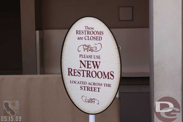 A sign in front of the old restrooms