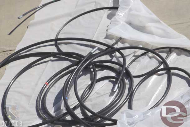 Some cables that have been pulled to a concrete pad near the Fun wheel