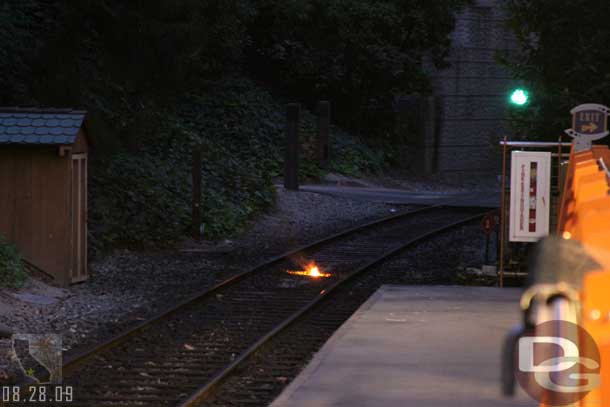 A small fire on the tracks.. left from the previous train.  When our train pulled up someone got out of the cab and put this out.