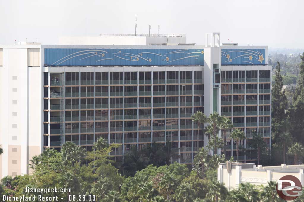 The renoovation work has started on half of the Dream Tower at the Disneyland hotel (the half on the left).  You can see the track for the lift on the far side where the windows have been removed.
