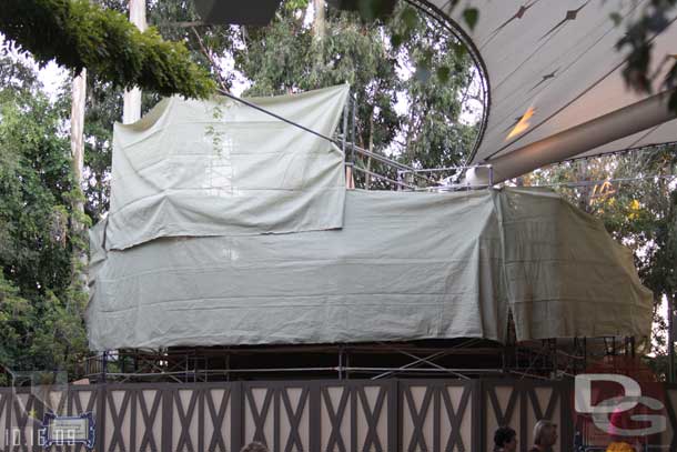 Tarps are now up on the Enchanted Cottage (the snack shack at the Fantasyland theater)