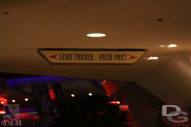 Noticed this sign as you walk out of Space Mountain.  Kind of interesting choices.. the Pizza or shopping.