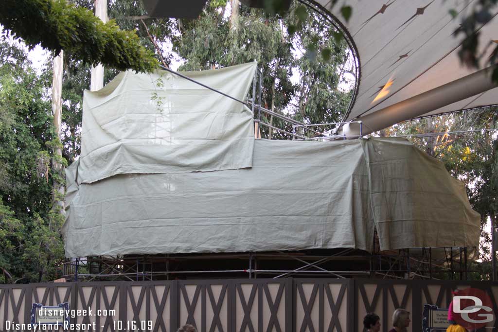 Tarps are now up on the Enchanted Cottage (the snack shack at the Fantasyland theater)