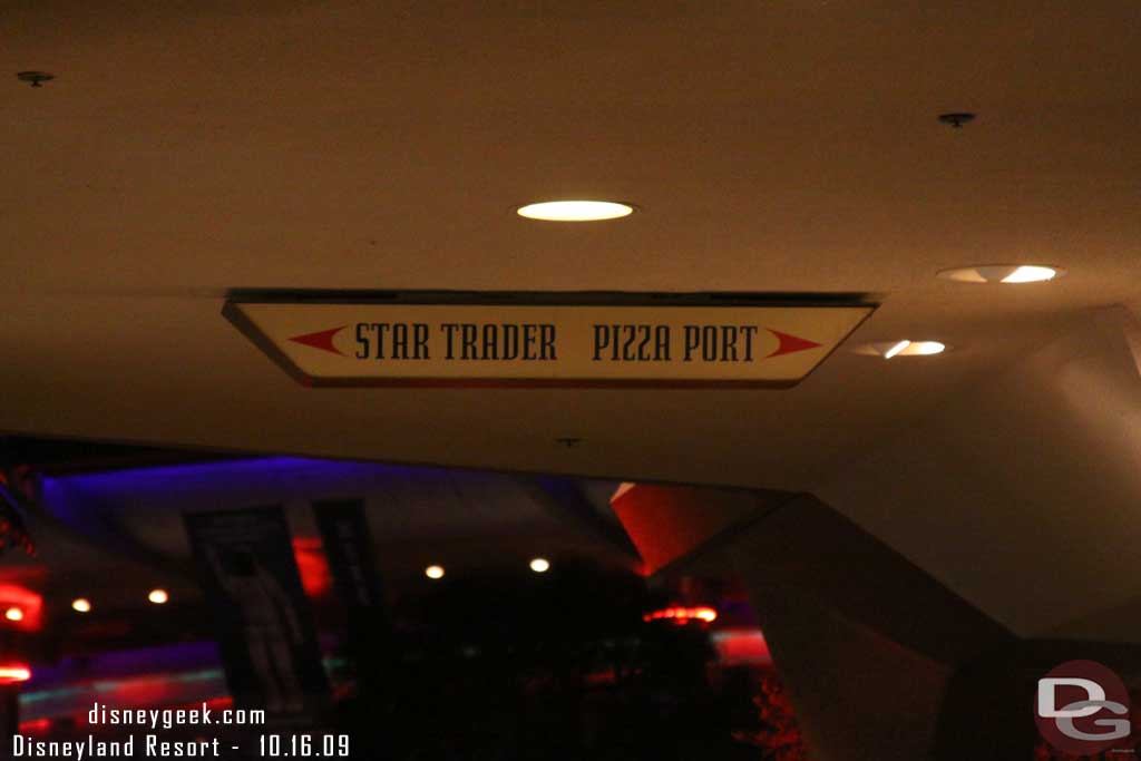 Noticed this sign as you walk out of Space Mountain.  Kind of interesting choices.. the Pizza or shopping.