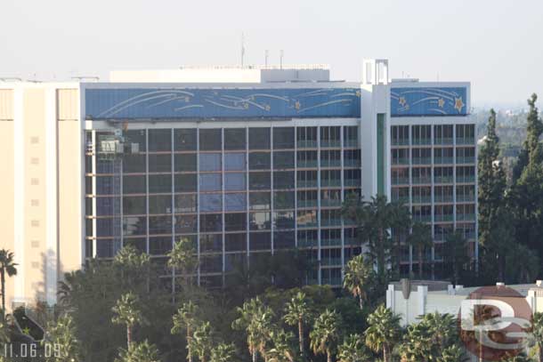 Over at the Disneyland Hotel looks like they are putting up plastic so they can paint this side of the tower.