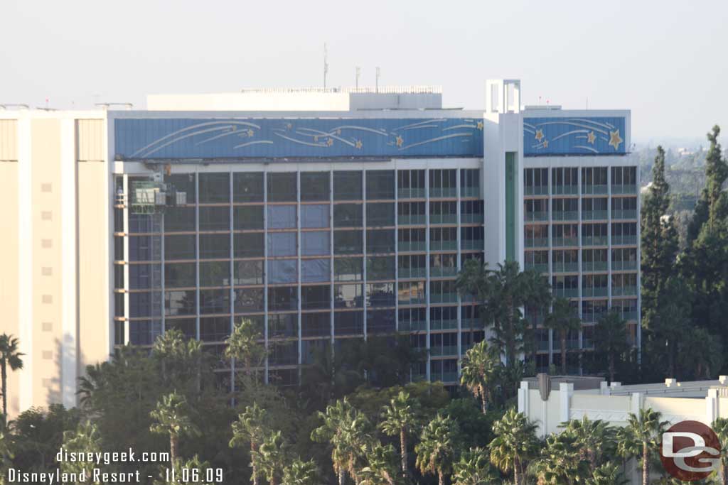 Over at the Disneyland Hotel looks like they are putting up plastic so they can paint this side of the tower.