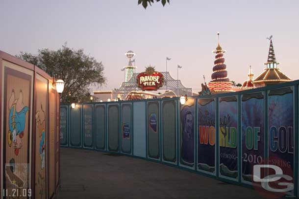 The wall curves around the fountain and back to the Pier entrance (if you kept following it to the left you would end up at the Coffee cart if that helps)