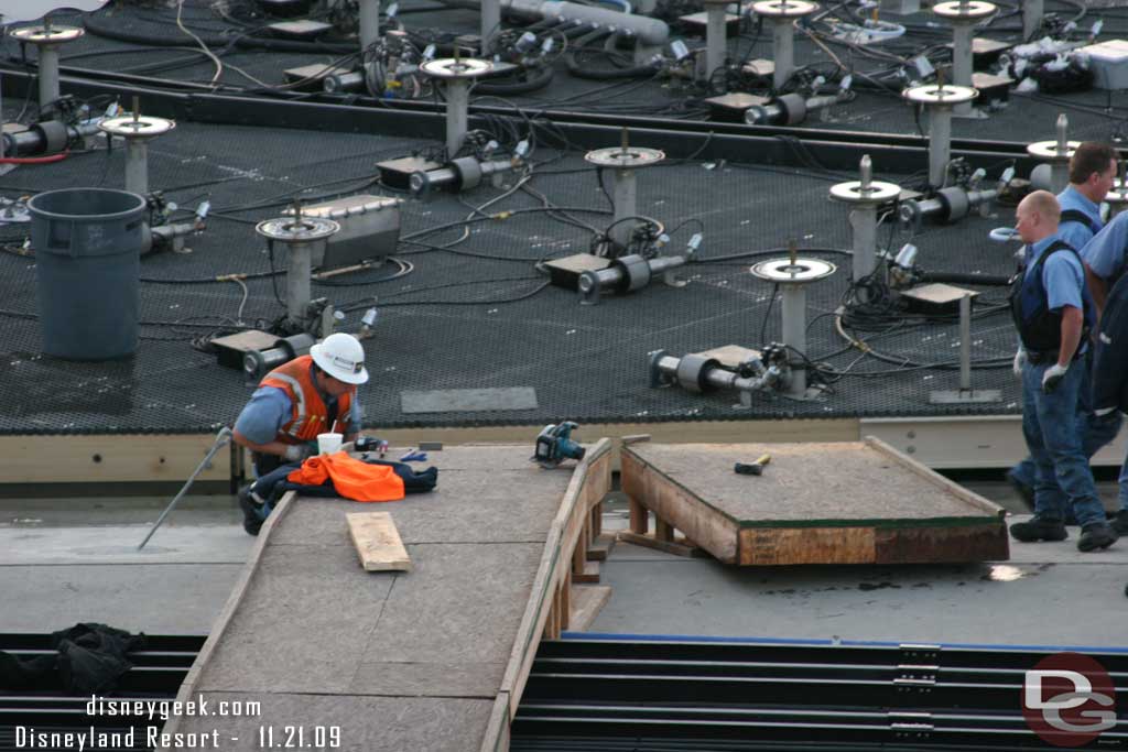 They were taking apart the bridge to the platform (or at least the last piece that connected to the platform was removed)