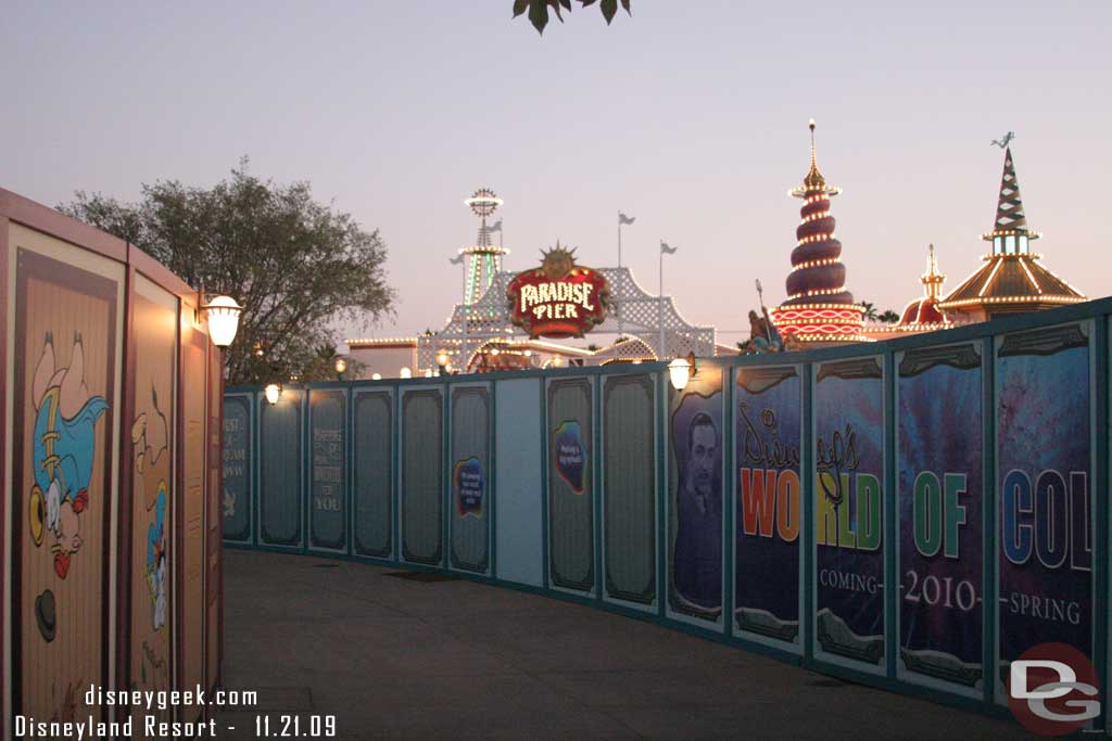 The wall curves around the fountain and back to the Pier entrance (if you kept following it to the left you would end up at the Coffee cart if that helps)