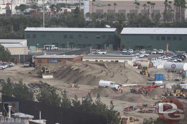 The mound of dirt is getting smaller.  Also the small part of asphalt that was left from the World of Color staging area looks to have been removed.