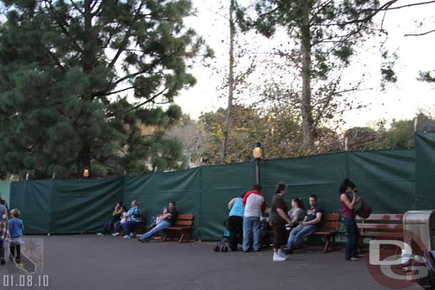 The Rivers of America are being drained so there is a wall, tarp up around it.