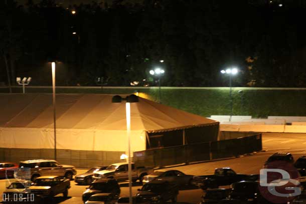 The tent is still up in the CM parking lot to the side of the garage.  Looks to be a tram in it?  (One site had rumors they are installing/testing doors/gates on the trams)