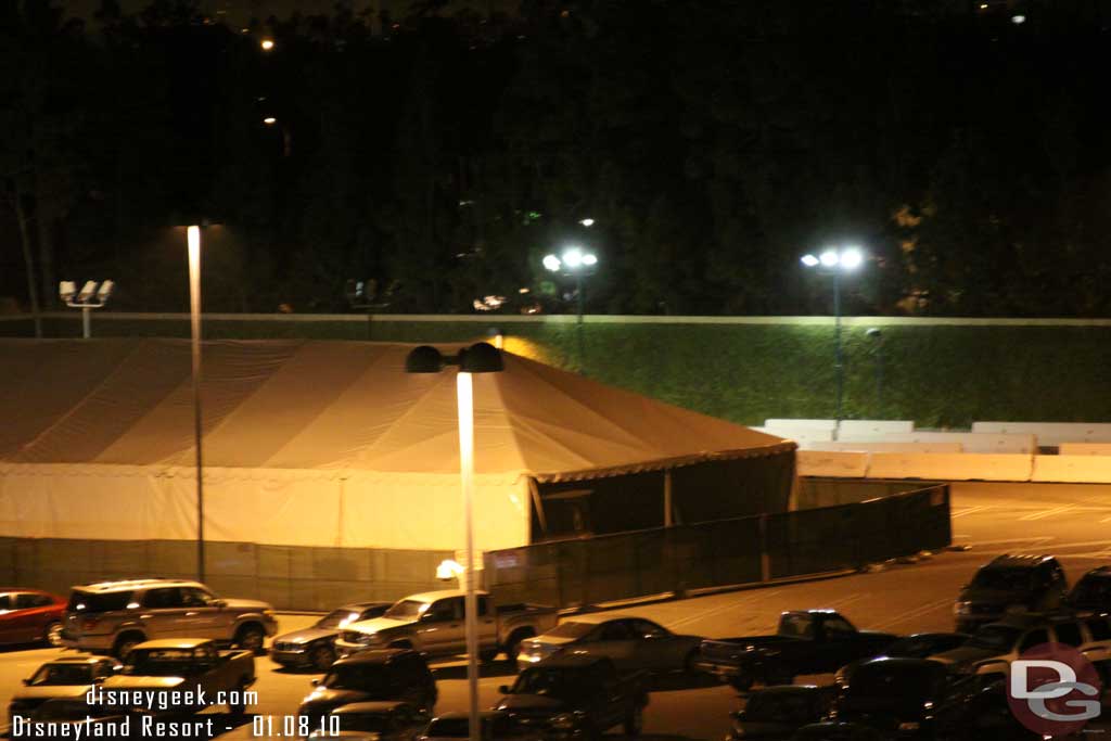 The tent is still up in the CM parking lot to the side of the garage.  Looks to be a tram in it?  (One site had rumors they are installing/testing doors/gates on the trams)