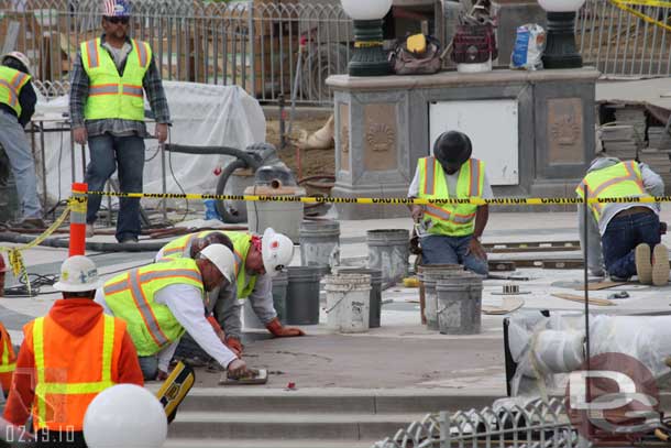 Quite a few people working on the fountain.