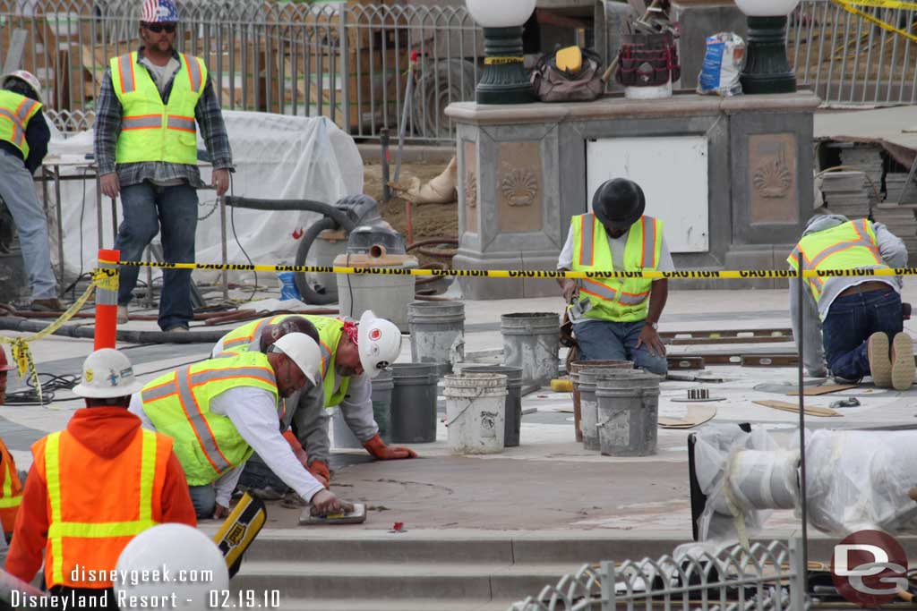 Quite a few people working on the fountain.