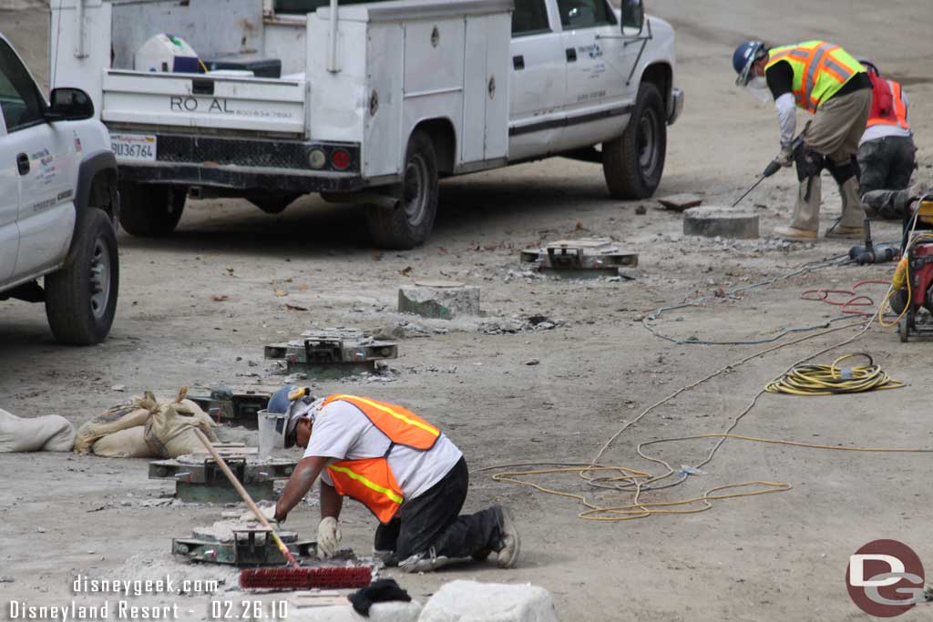 Looks like they were cleaning the concrete out from around the track support.