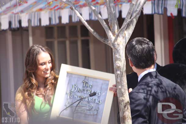 He is presented with a replica of the window