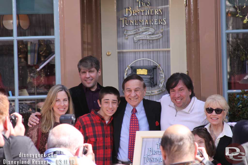 The Sherman family in front of the window.