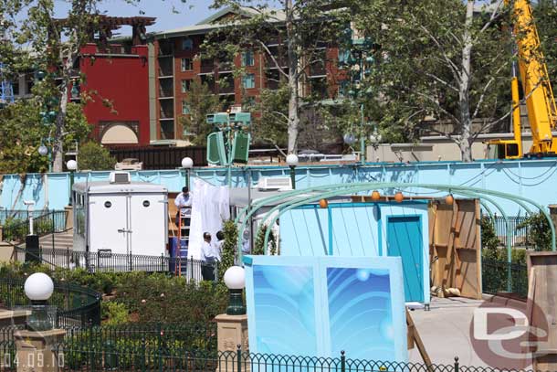 They were prepping the area to open.  Here you can see the walls and drapes going around the programming trailers for World of Color. 