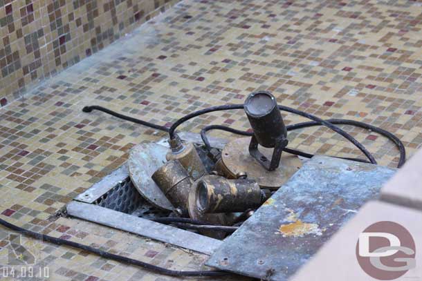 The water is out of the fountain near the restrooms, and the lights are all stacked up in the middle.