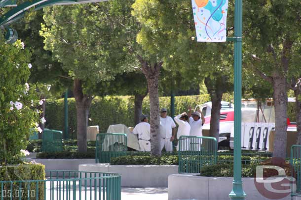 A crew painting the rails at the tram stop