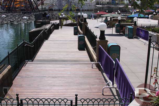 The lower boardwalk is still closed, but there are trashcans there and it looks ready to go.  Best guess is it is closed so they can work on the World of Color equipment with no problems.