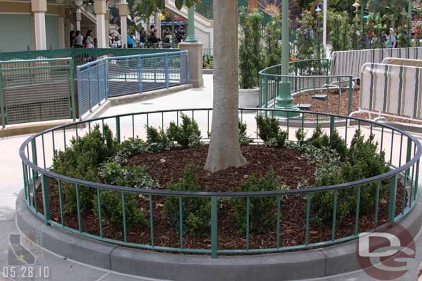 A planter around one of the trees