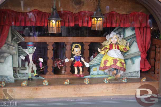 The puppets in the window of the candy shoppe were moving around today.