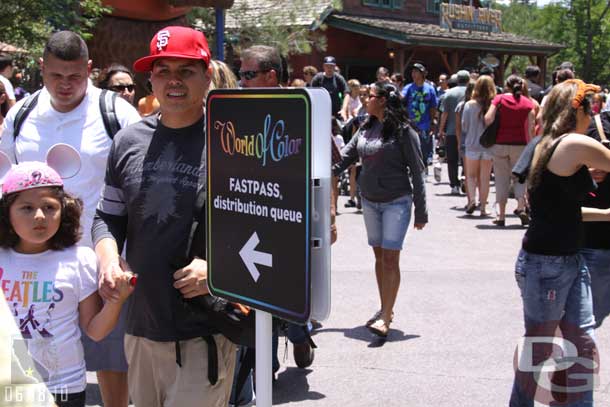 Time to head for the World of Color Fastpasses (and if you do not pay attention you will miss the sign with the crowd in the area)