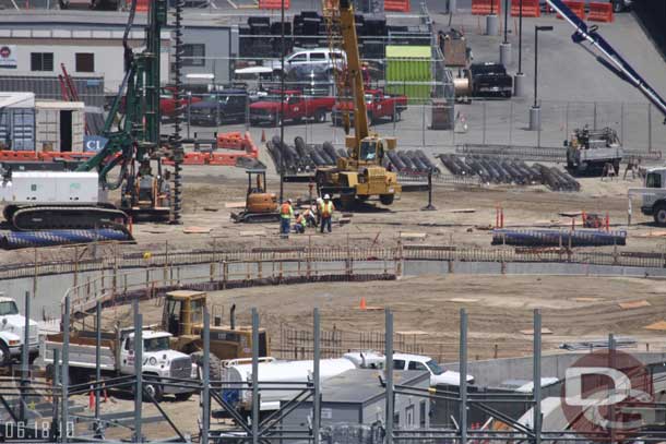 Looks like the holes are still being drilled for the footers for the rock/steel work on the far side of cars land.