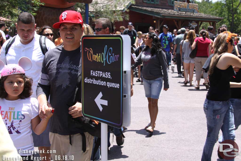 Time to head for the World of Color Fastpasses (and if you do not pay attention you will miss the sign with the crowd in the area)